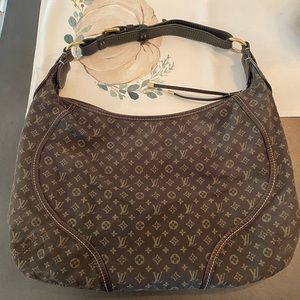 Louis Vuitton
Manon Handbag Mini Lin PM
